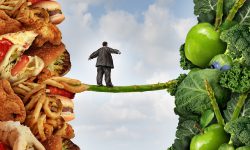 Diet change healthy lifestyle concept and having the courage to accept the challenge of losing weight and fighting obesity and diabetes as an overweight person walking on a highwire asparagus from fatty food towards vegetables and fruit.